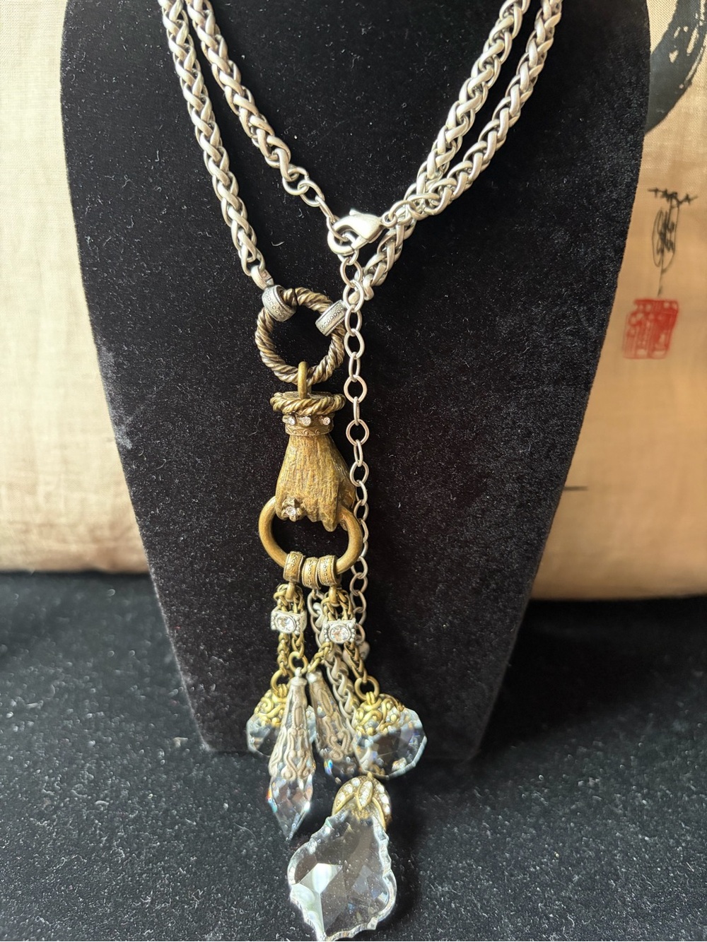 Sweet Romance Silver Tone Braid Necklace with Bronze Hand and Crystal tassels